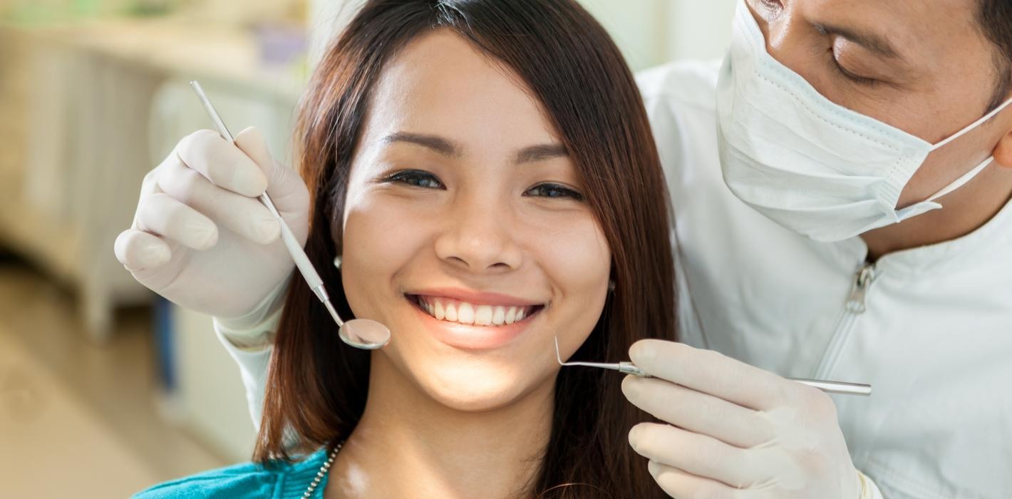 Dental professional caring for a patient